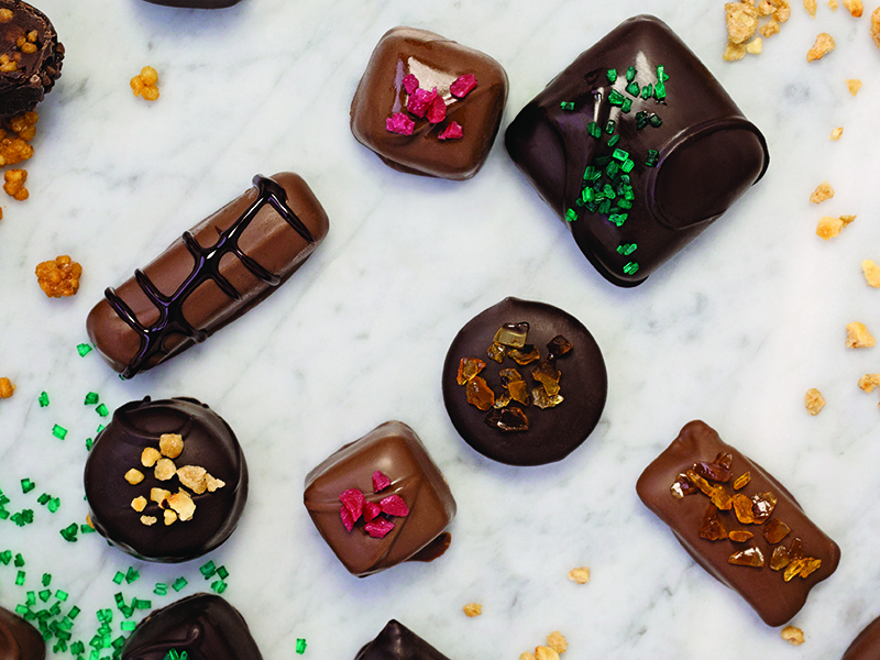 Chocolate truffles with candy pieces and glazed quinoa